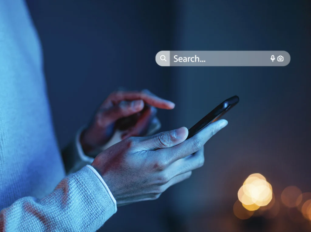 User speaking into phone — voice search for “lawyer near me” in Utah
